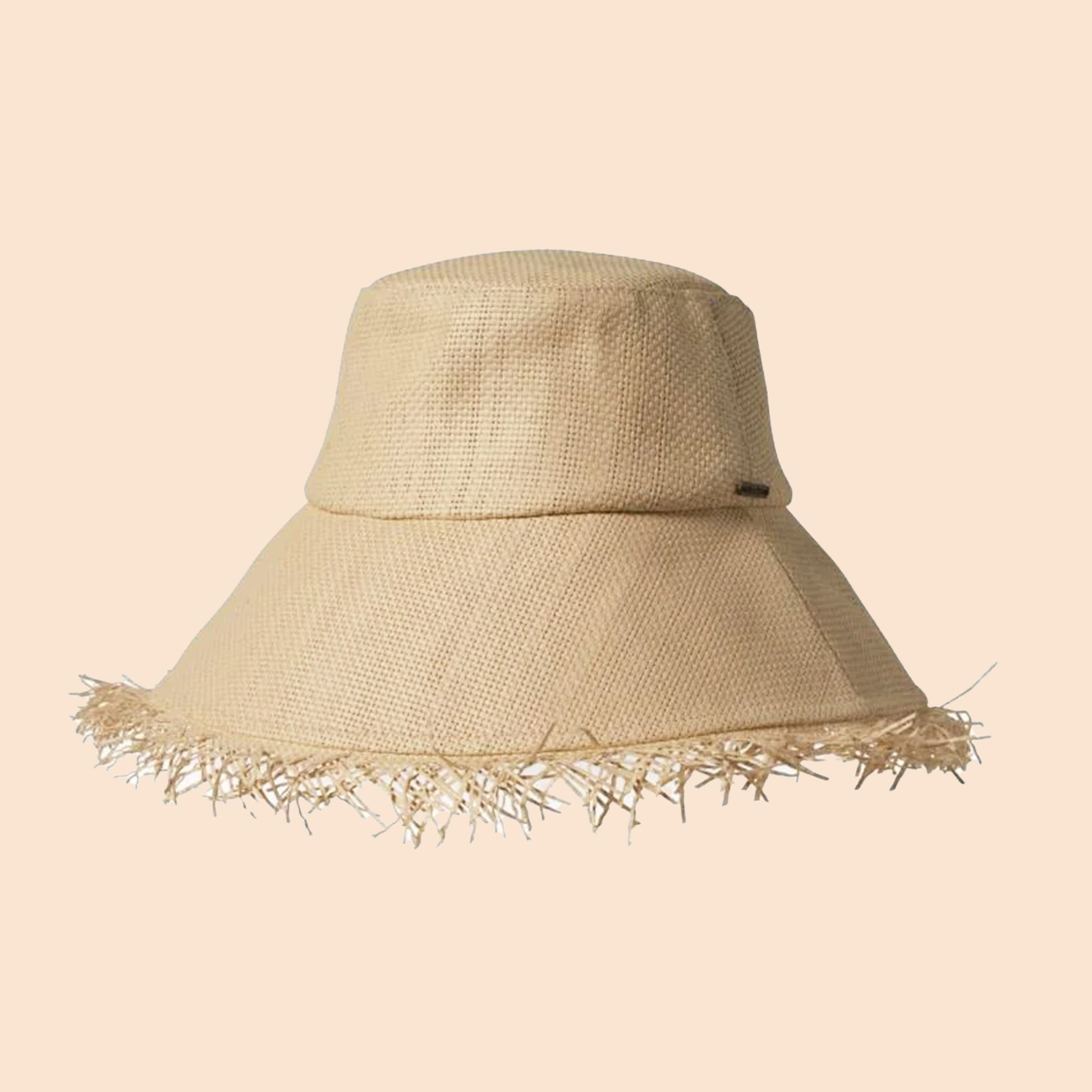 A tan woven bucket hat with a fringe edge.